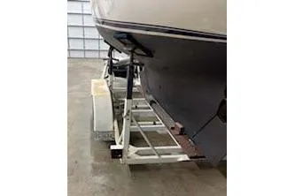 Slide: The Image of 1984 Cape Dory 25D sailboat in storage, showcasing its elegant stern design. - 10