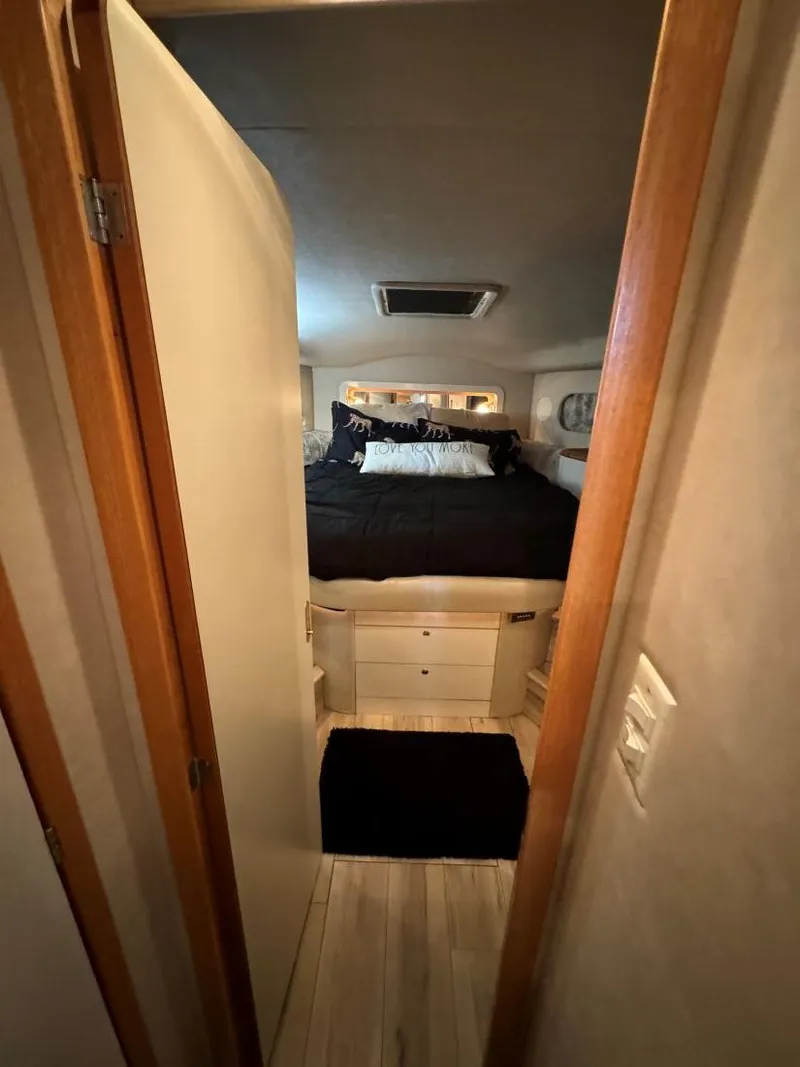Slide: The Image of Cozy bedroom interior of 1996 Sea Ray 400 Sedan Bridge yacht. - 28