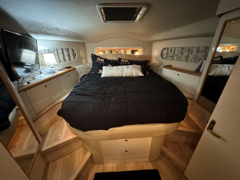 Slide: The Image of Luxurious bedroom interior of 1996 Sea Ray 400 Sedan Bridge yacht. - 29