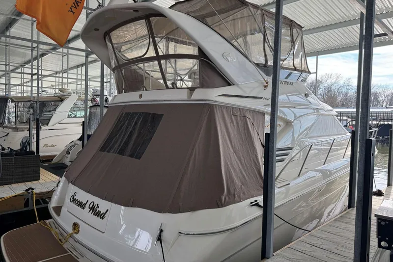 Slide: The Image of 1996 Sea Ray 400 Sedan Bridge docked under a covered marina. - 3