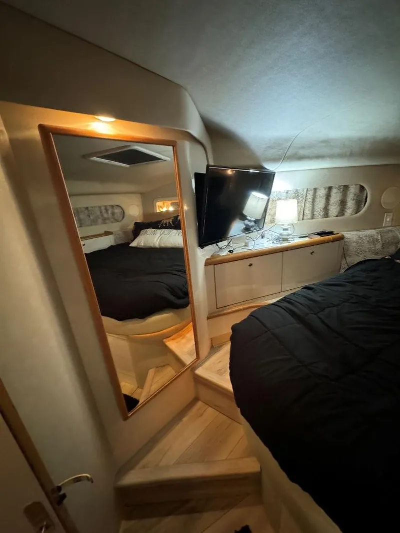 Slide: The Image of Interior of 1996 Sea Ray 400 Sedan Bridge with cozy bedroom and modern amenities. - 30