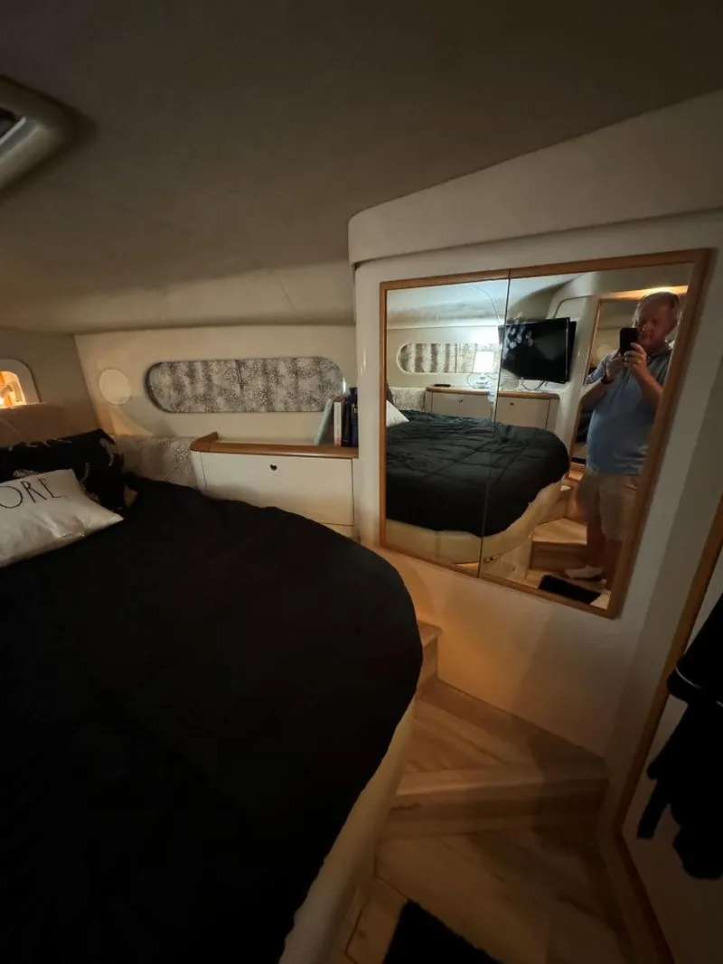 Slide: The Image of Interior of 1996 Sea Ray 400 Sedan Bridge yacht with bed and mirror. - 31