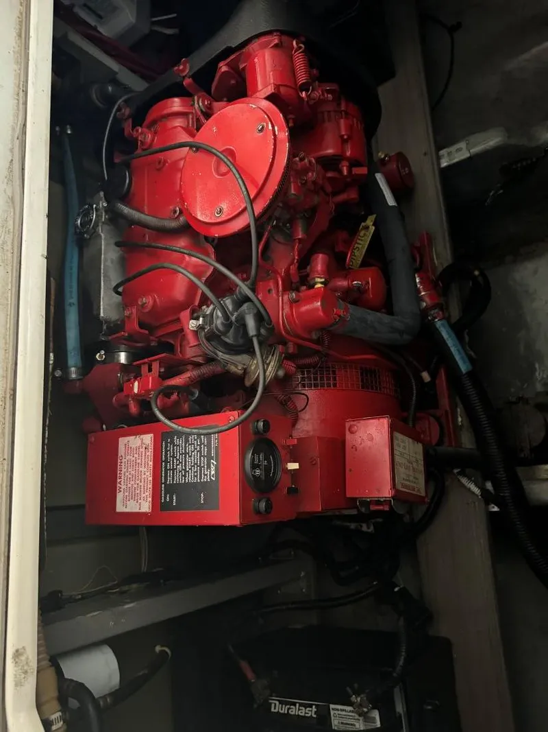 Slide: The Image of Engine compartment of a 1996 Sea Ray 400 Sedan Bridge with red machinery. - 41
