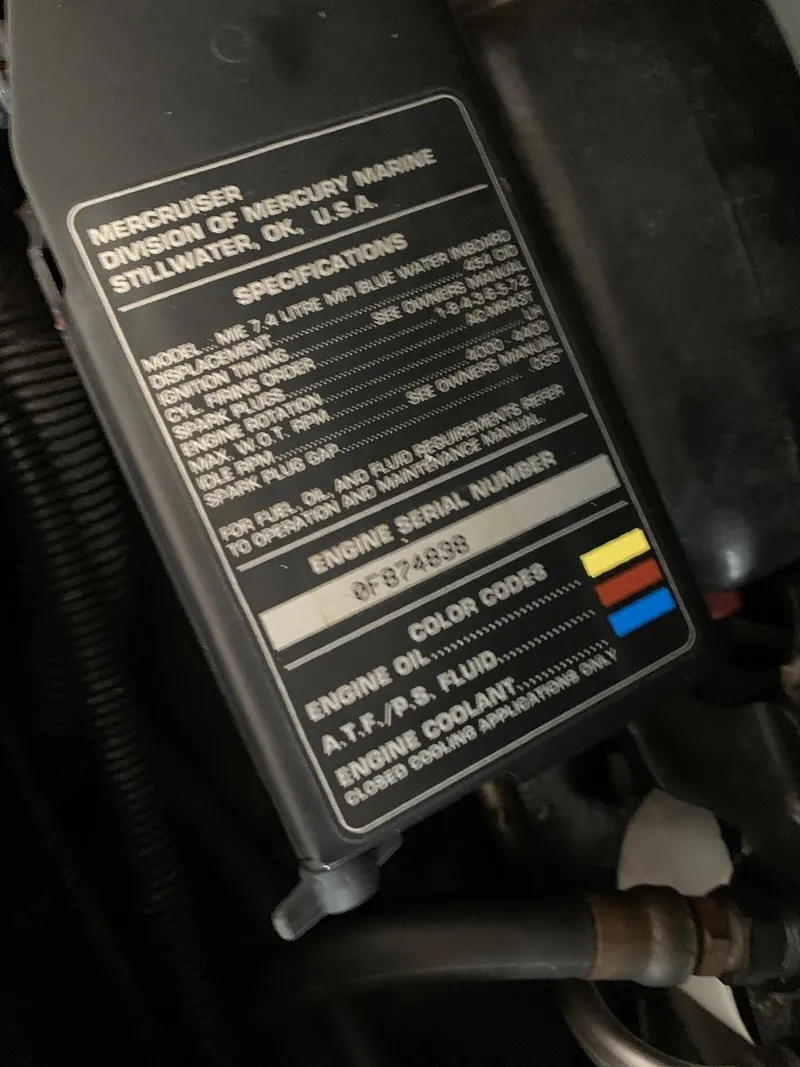Slide: The Image of Engine specifications label on a 1996 Sea Ray 400 Sedan Bridge. - 43