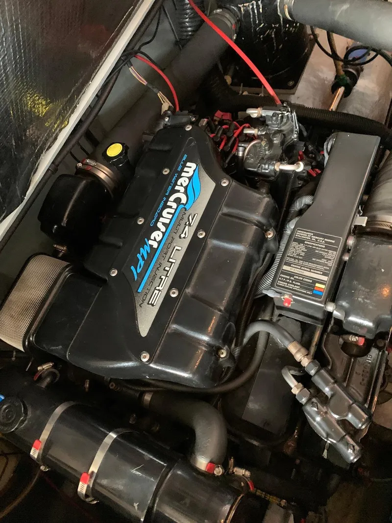 Slide: The Image of 1996 Sea Ray 400 Sedan Bridge engine, featuring a MerCruiser V8 motor. - 44