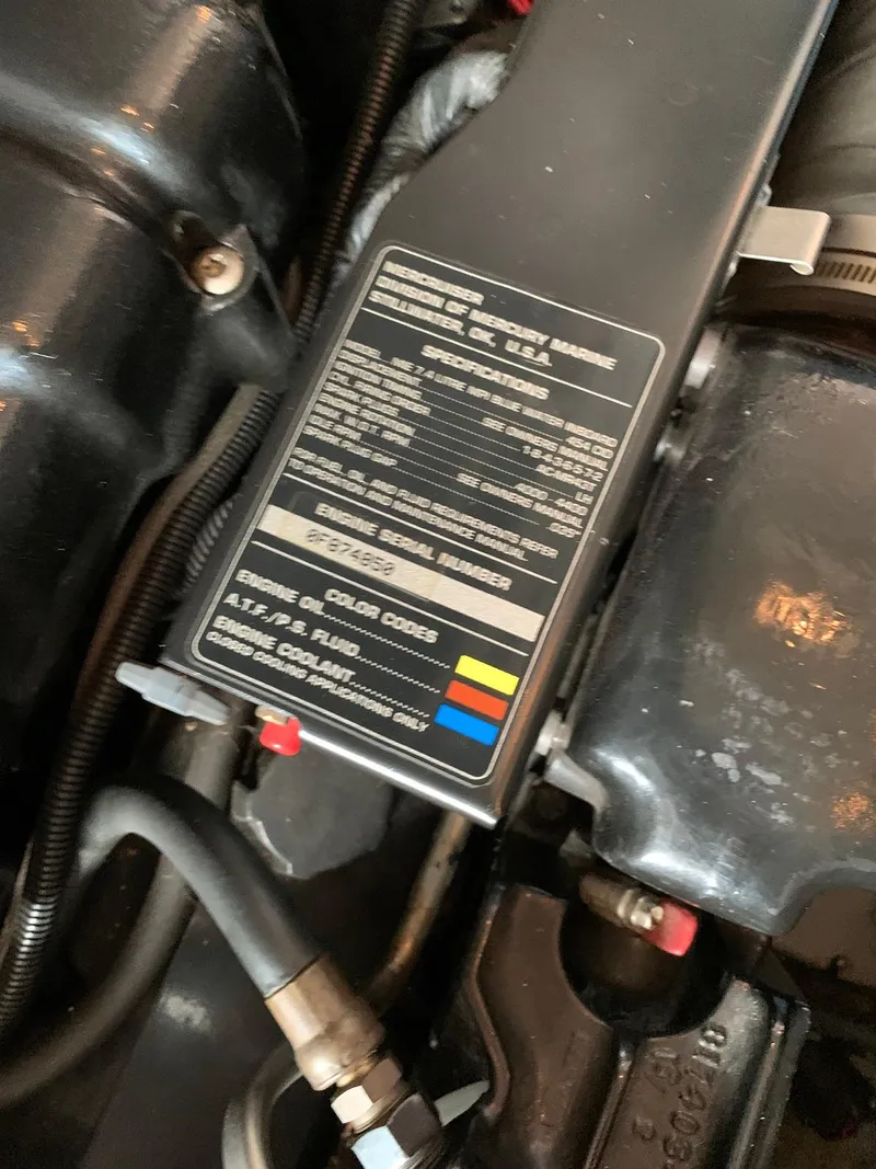 Slide: The Image of Engine compartment of 1996 Sea Ray 400 Sedan Bridge with specifications label. - 45