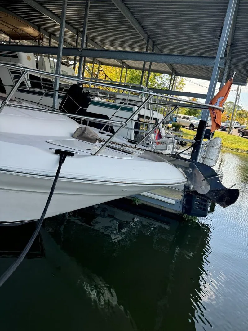 Slide: The Image of 1996 Sea Ray 400 Sedan Bridge docked in a covered marina. - 6