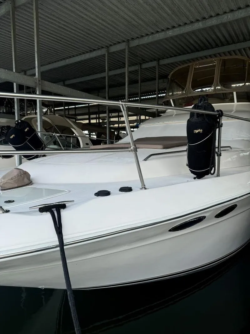 Slide: The Image of 1996 Sea Ray 400 Sedan Bridge yacht docked in covered marina. - 8