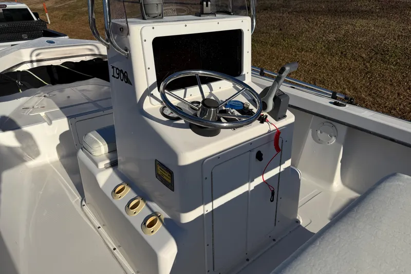Slide: The Image of 2010 Maycraft 1900 boat console with steering wheel and controls. - 3