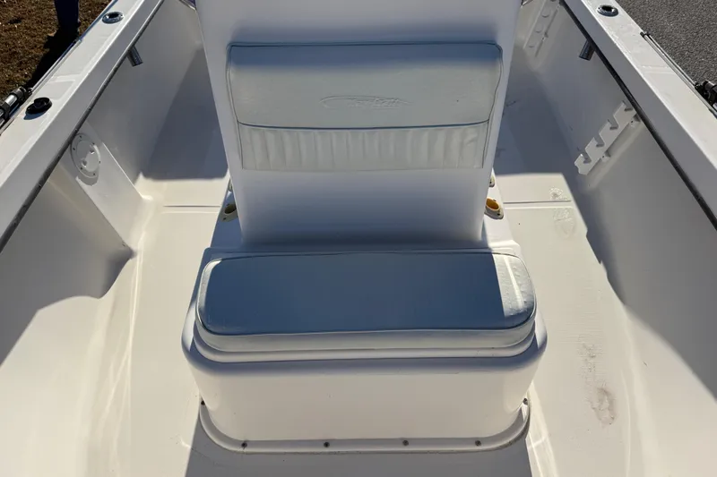 Slide: The Image of Maycraft 1900 boat interior, 2010 model, featuring white cushioned seating. - 7