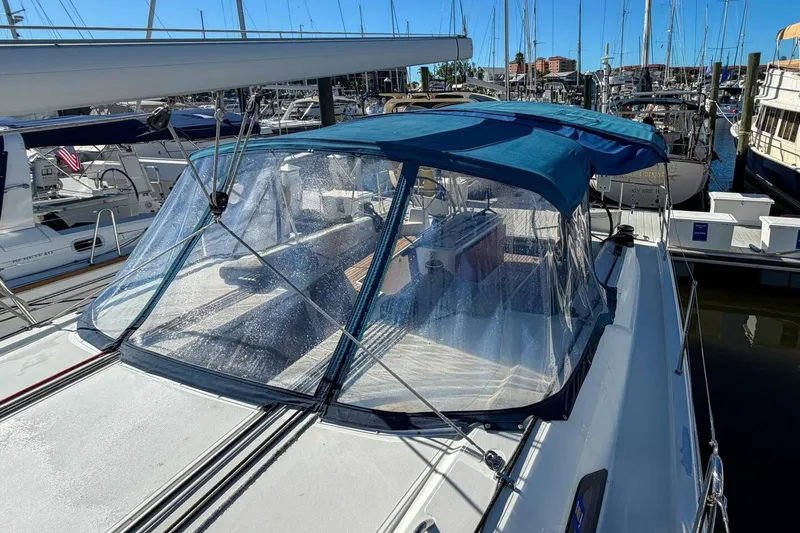 Slide: The Image of 2022 Beneteau Oceanis 40.1 sailboat deck view in marina, showcasing sleek design and rigging. - 105