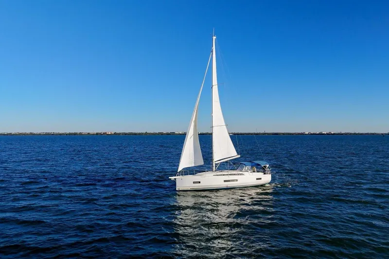 Slide: The Image of 2022 Beneteau Oceanis 40.1 sailing on open blue sea under clear sky. - 139