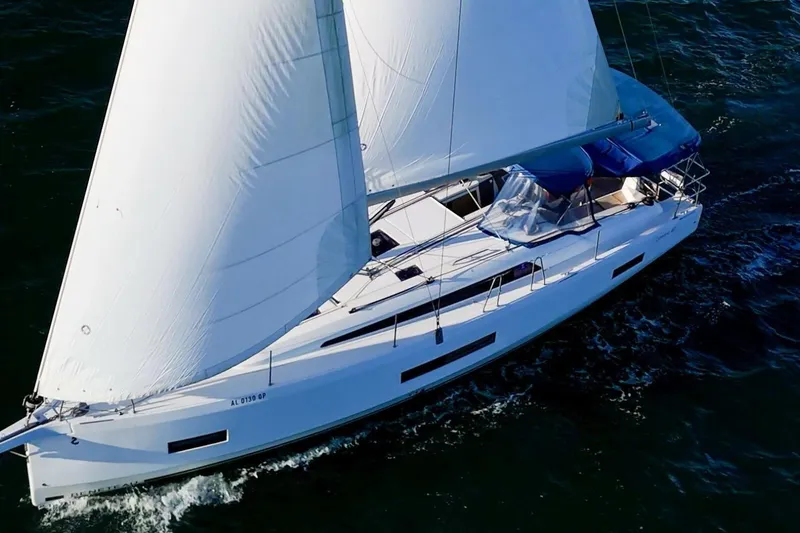 Slide: The Image of 2022 Beneteau Oceanis 40.1 sailing yacht on open water, showcasing sleek design and white sails. - 145