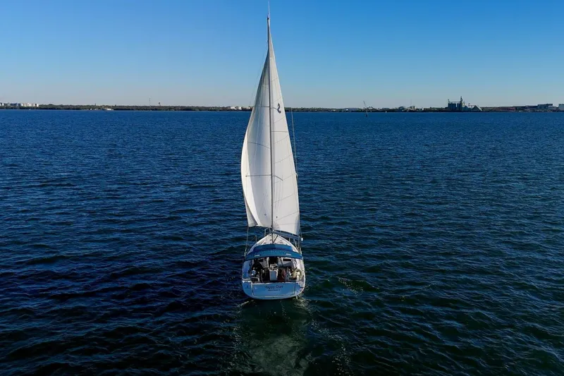 Slide: The Image of 2022 Beneteau Oceanis 40.1 sailing on open water under clear blue sky. - 148