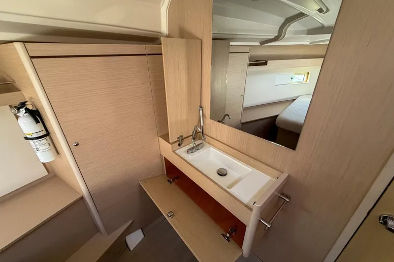 Slide: The Image of Interior of 2022 Beneteau Oceanis 40.1 yacht bathroom with sink and mirror. - 15