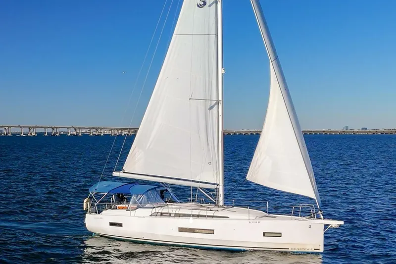 Slide: The Image of 2022 Beneteau Oceanis 40.1 sailing on open water under clear blue sky. - 153