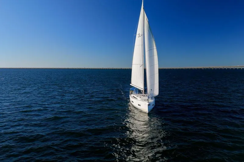 Slide: The Image of 2022 Beneteau Oceanis 40.1 sailing on open sea under clear blue sky. - 155
