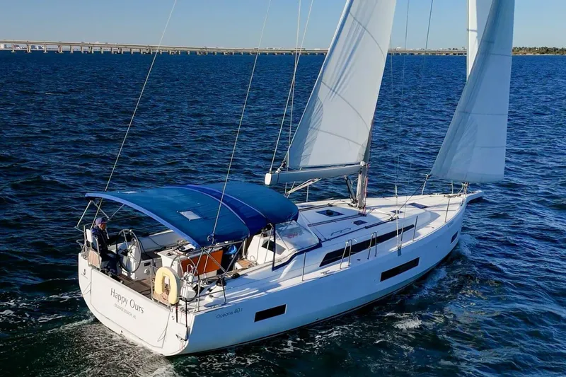 Slide: The Image of 2022 Beneteau Oceanis 40.1 sailing on open water under clear skies. - 165