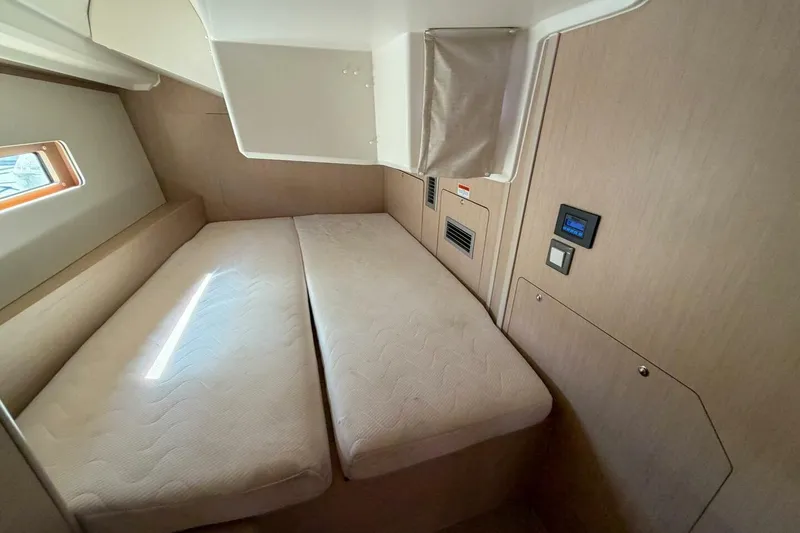 Slide: The Image of Interior cabin of 2022 Beneteau Oceanis 40.1 yacht with twin beds and modern design. - 21