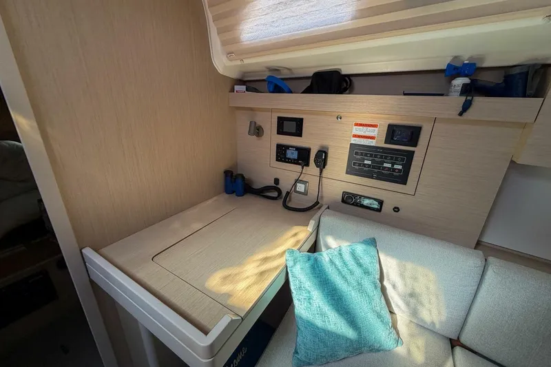 Slide: The Image of Interior of 2022 Beneteau Oceanis 40.1 yacht with navigation station and seating area. - 36