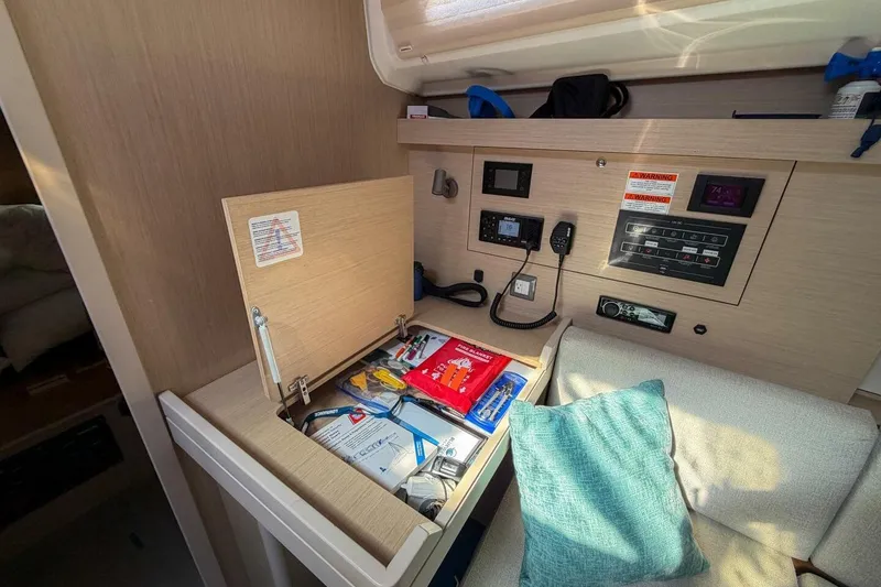 Slide: The Image of Interior of 2022 Beneteau Oceanis 40.1 yacht with navigation equipment and storage compartment. - 37