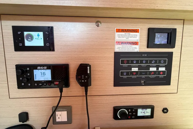 Slide: The Image of Control panel of a 2022 Beneteau Oceanis 40.1 yacht with navigation and communication systems. - 38