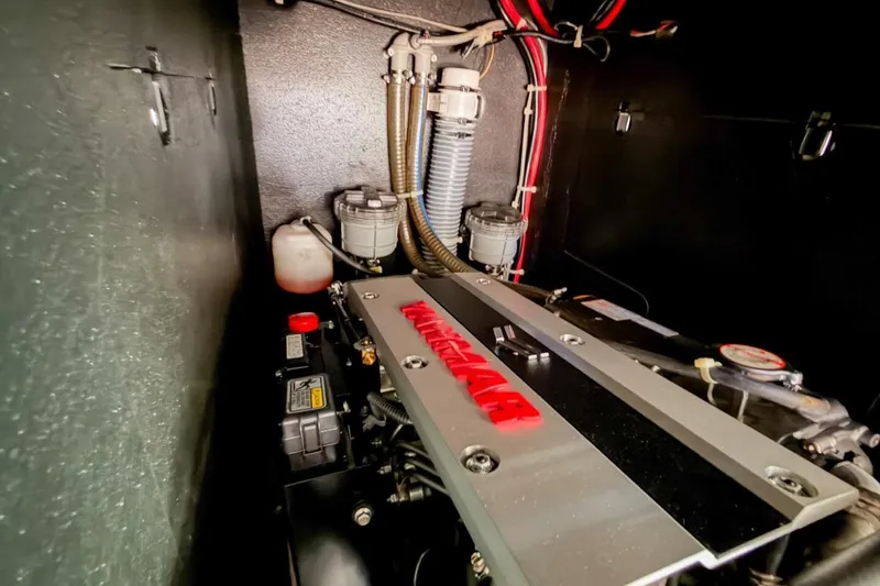 Slide: The Image of Engine compartment of 2022 Beneteau Oceanis 40.1 sailboat, featuring Yanmar engine components. - 40