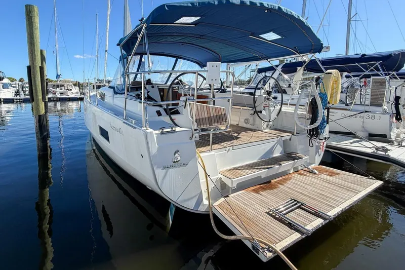 Slide: The Image of 2022 Beneteau Oceanis 40.1 sailboat docked at marina under clear blue sky. - 47