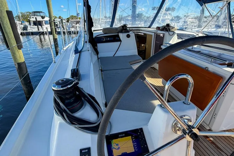 Slide: The Image of Beneteau Oceanis 40.1 cockpit with teak flooring, 2022 model, showcasing steering wheel and deck details. - 53
