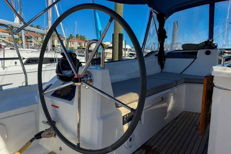 Slide: The Image of Cockpit of 2022 Beneteau Oceanis 40.1 with navigation display and steering wheel. - 56