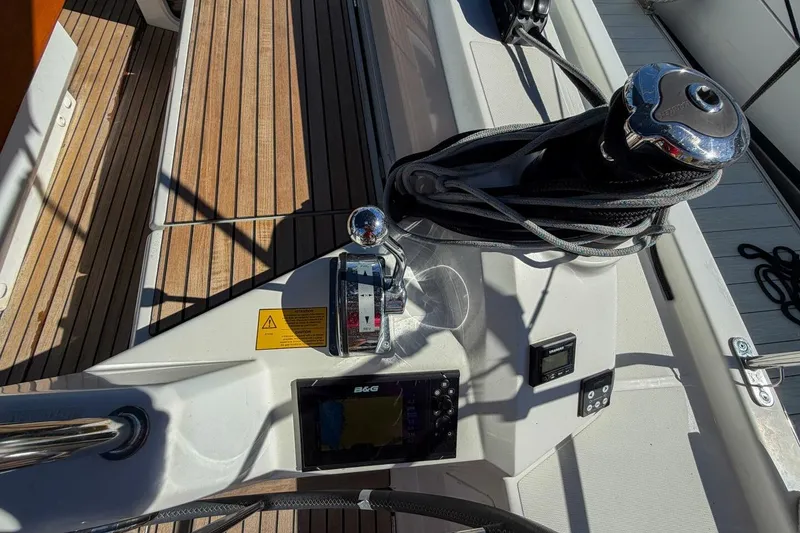 Slide: The Image of Steering wheel view of 2022 Beneteau Oceanis 40.1 sailboat cockpit with navigation equipment. - 64