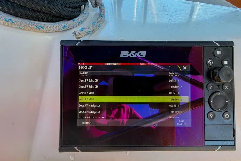 Slide: The Image of B&G navigation display on 2022 Beneteau Oceanis 40.1 sailboat, showing device list and controls. - 71