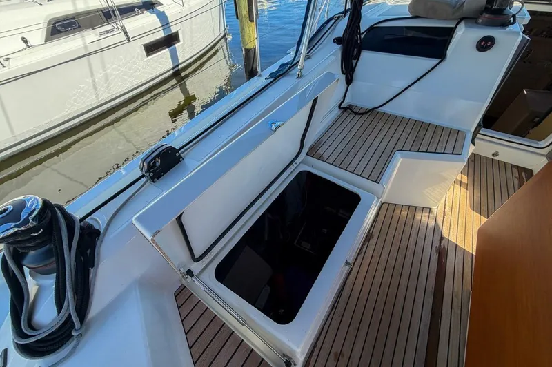 Slide: The Image of 2022 Beneteau Oceanis 40.1 yacht deck with open storage compartment. - 77