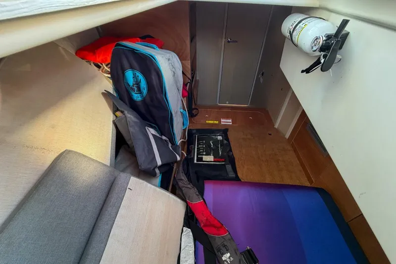Slide: The Image of Interior view of 2022 Beneteau Oceanis 40.1 sailboat storage area with equipment. - 79