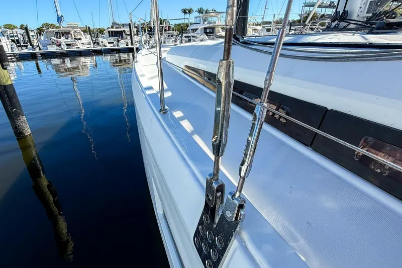 Slide: The Image of 2022 Beneteau Oceanis 40.1 sailboat docked at marina under clear blue sky. - 93