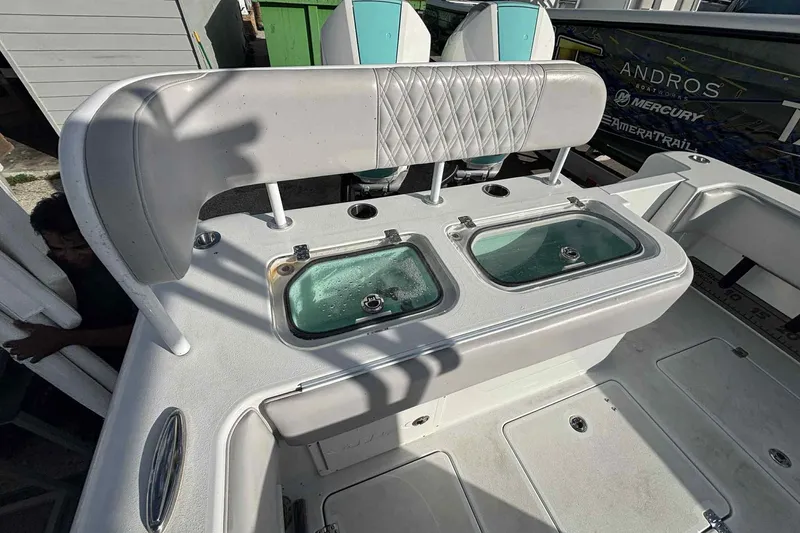 Slide: The Image of 2023 Andros Offshore 32 boat with dual livewells and cushioned seating. - 13