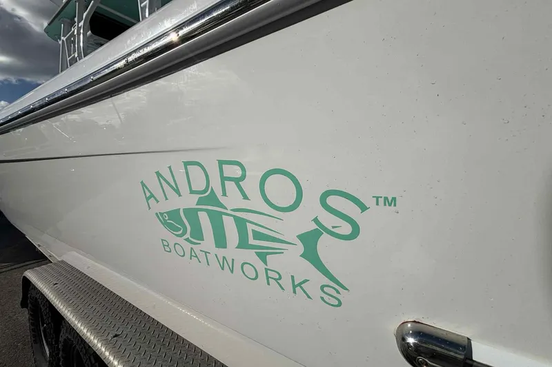Slide: The Image of 2023 Andros Offshore 32 boat with logo on the side, showcasing sleek design. - 5