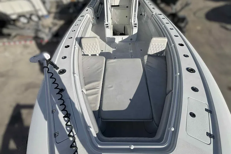 Slide: The Image of 2023 Andros Offshore 32 boat interior with cushioned seating and storage compartments. - 6