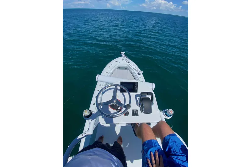 Slide: The Image of 2023 Andros Offshore 32 boat steering console on open water. - 9