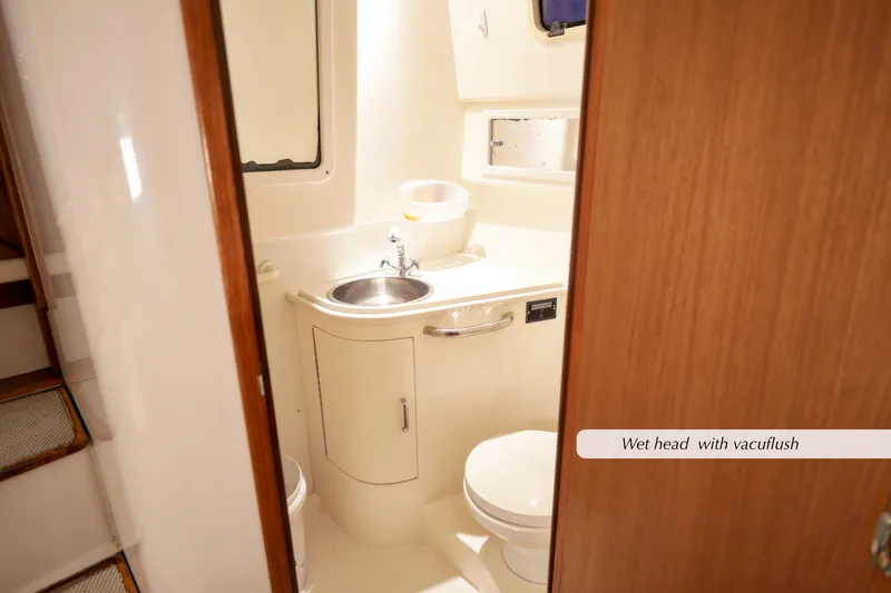 Slide: The Image of Wet head with sink and toilet in 2000 Cabo 35 Express boat. - 24