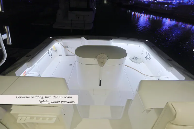 Slide: The Image of 2000 Cabo 35 Express boat with illuminated deck, gunwale padding, and high-density foam. - 25