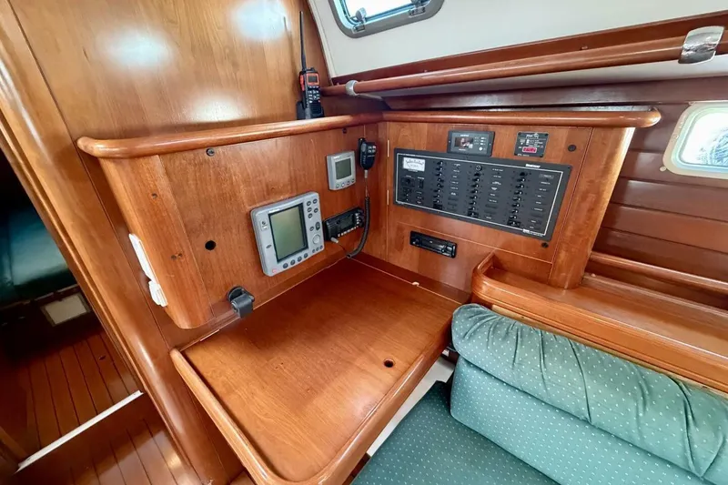 Slide: The Image of Navigation station of 2000 Beneteau Oceanis 461 sailboat with control panel and instruments. - 14