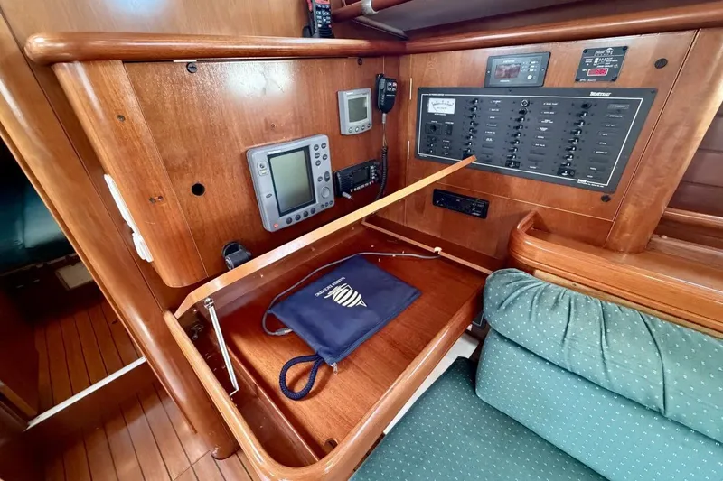 Slide: The Image of Navigation station of 2000 Beneteau Oceanis 461 sailboat with control panel and instruments. - 15
