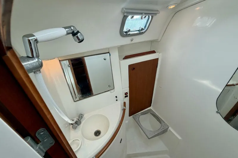 Slide: The Image of Bathroom interior of 2000 Beneteau Oceanis 461 yacht with sink and mirror. - 25