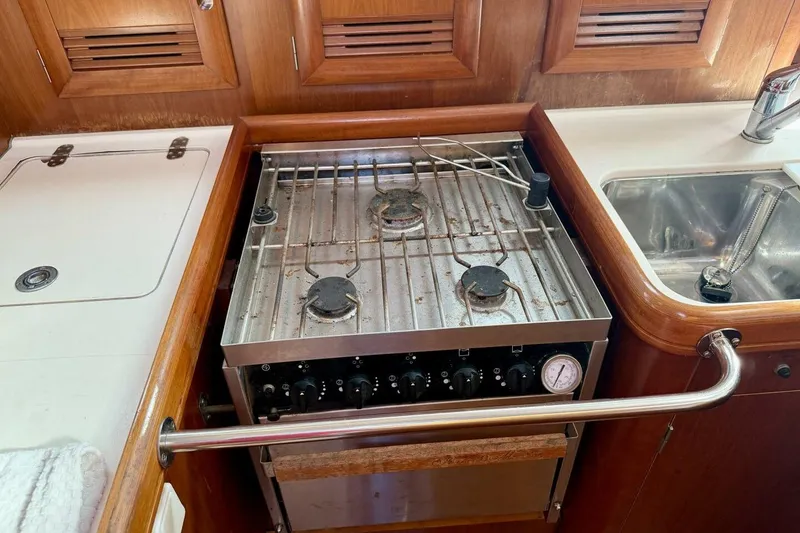 Slide: The Image of Galley kitchen in 2000 Beneteau Oceanis 461 sailboat with stove and sink. - 38