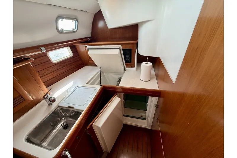 Slide: The Image of Interior of 2000 Beneteau Oceanis 461 yacht kitchen with sink and storage. - 40