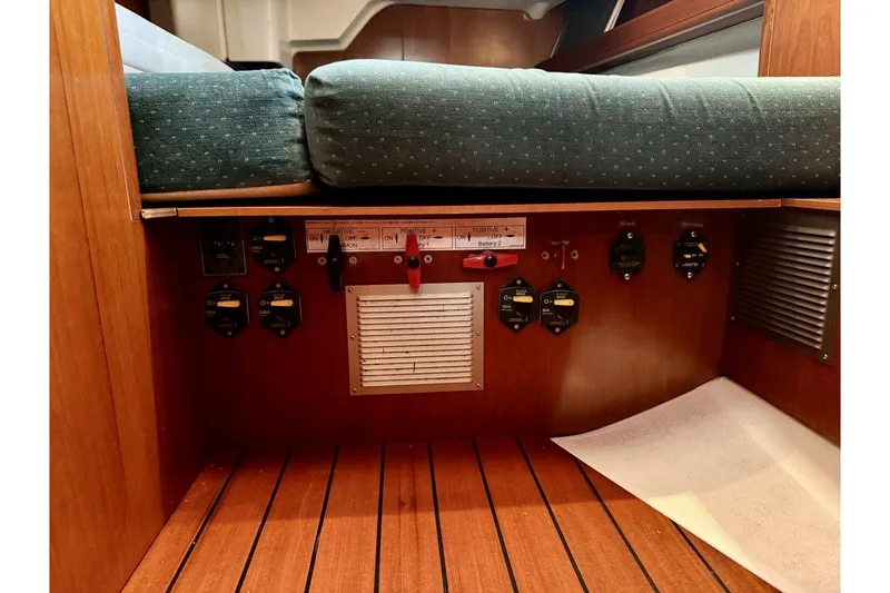 Slide: The Image of Interior view of a 2000 Beneteau Oceanis 461 sailboat showing electrical panel and wooden flooring. - 41
