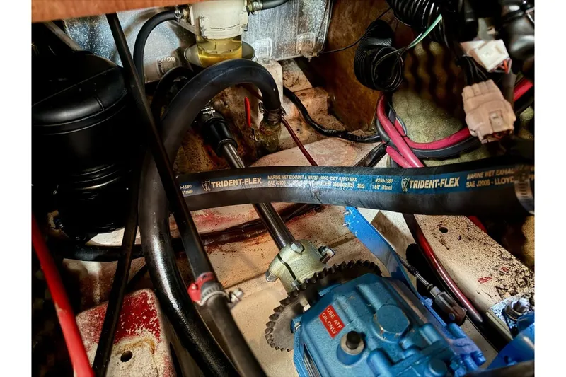 Slide: The Image of Engine compartment of a 2000 Beneteau Oceanis 461 sailboat with Trident-Flex hose. - 45