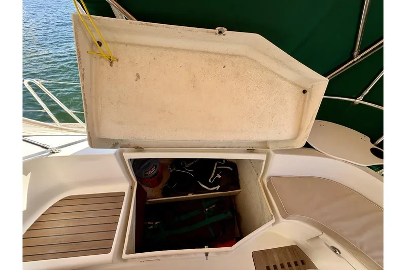 Slide: The Image of Open storage compartment on 2000 Beneteau Oceanis 461 sailboat, showing interior space and equipment. - 56