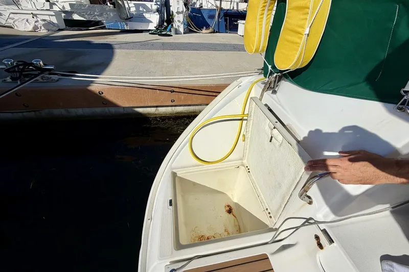 Slide: The Image of Beneteau Oceanis 461 (2000) yacht deck with open storage compartment. - 61